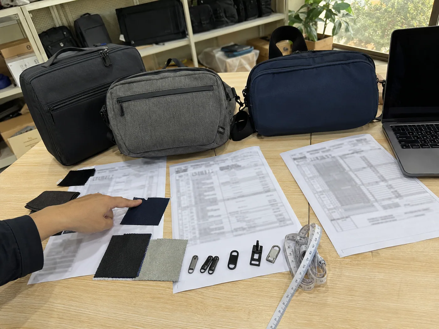 Smartphone-style QC desk checking tote bag stitching, seam alignment, measurement tools, and inspection checklist