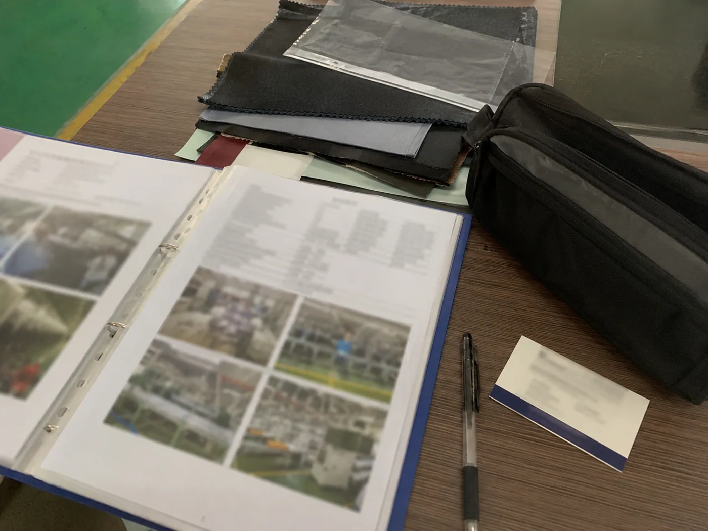 Smartphone-style supplier profile binder with redacted audit pages, factory photos, swatches, and sample pouch